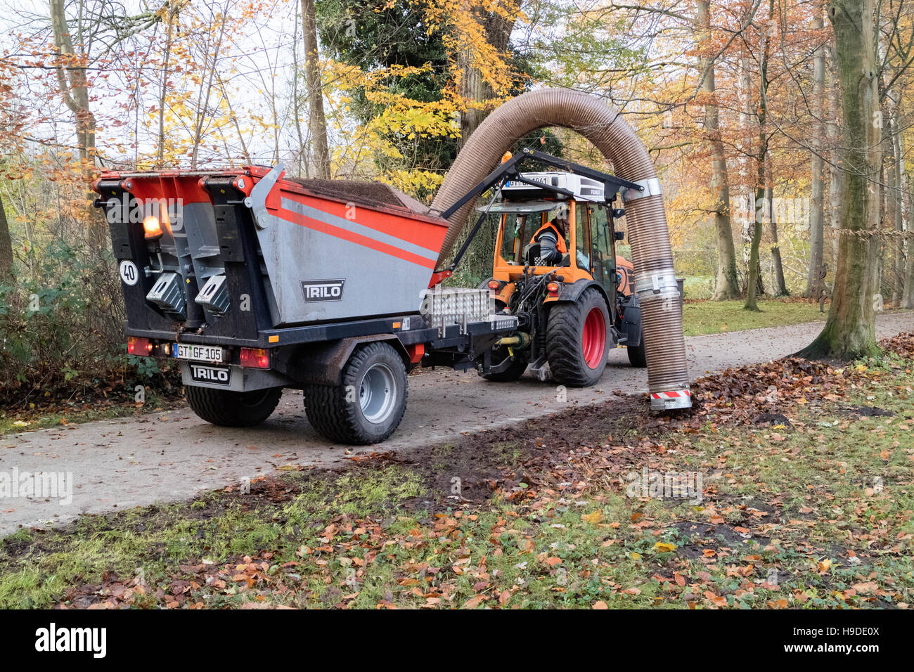A machine in Germany to suck up leaves from the ground in autumn Stock Photo