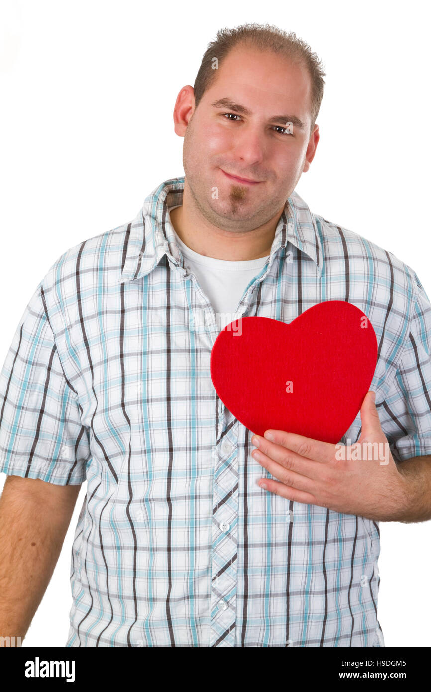 Young man holding red heart - isolated on white background Stock Photo ...
