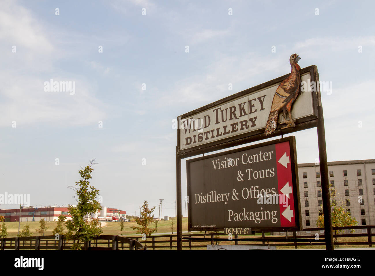 Lawrenceburg, KY, USA - October 19, 2016 : Entrance sign in front of Wild Turkey Bourbon Distillery with rik house and bottling plant in background. Stock Photo