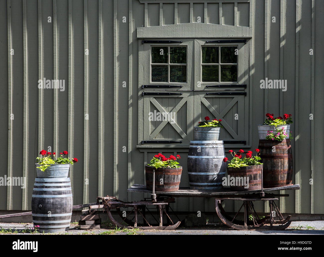 Wine barrel of flowers in front of a historic mill in Lancaster County