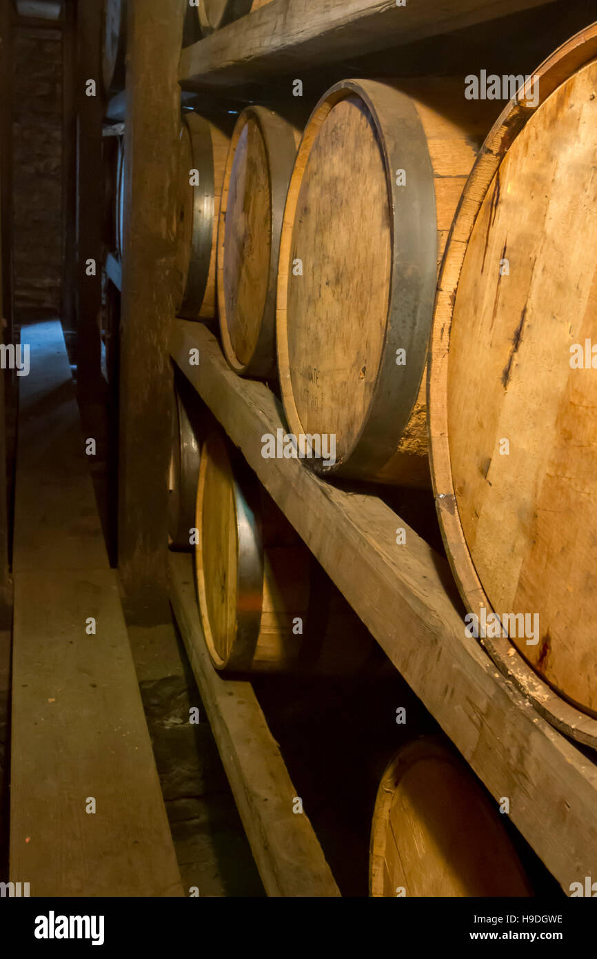 Oak barrels aging on wooden racks inside bourbon distillery Rik house Stock Photo Alamy