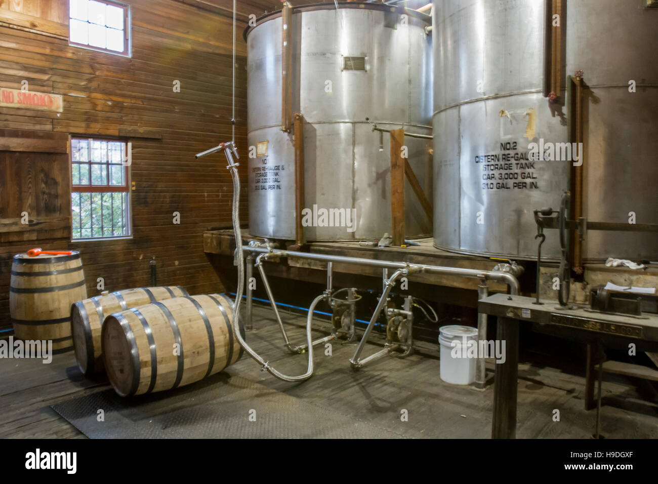 Barrel filling operations at craft bourbon distillery. Stock Photo
