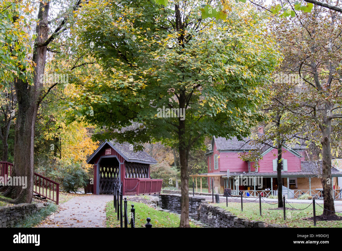Path leading to wooden covered bridge over Whisky Creek in Kentucky bourbon country. Stock Photo