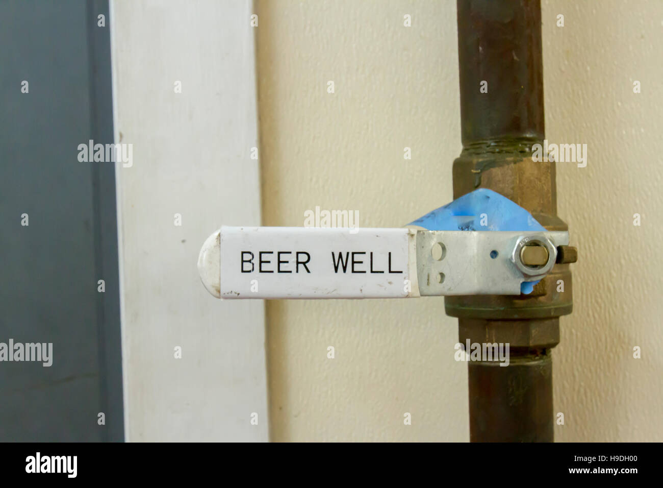 Beer well shut off valve inside modern fermentation room  in bourbon distillery. Stock Photo