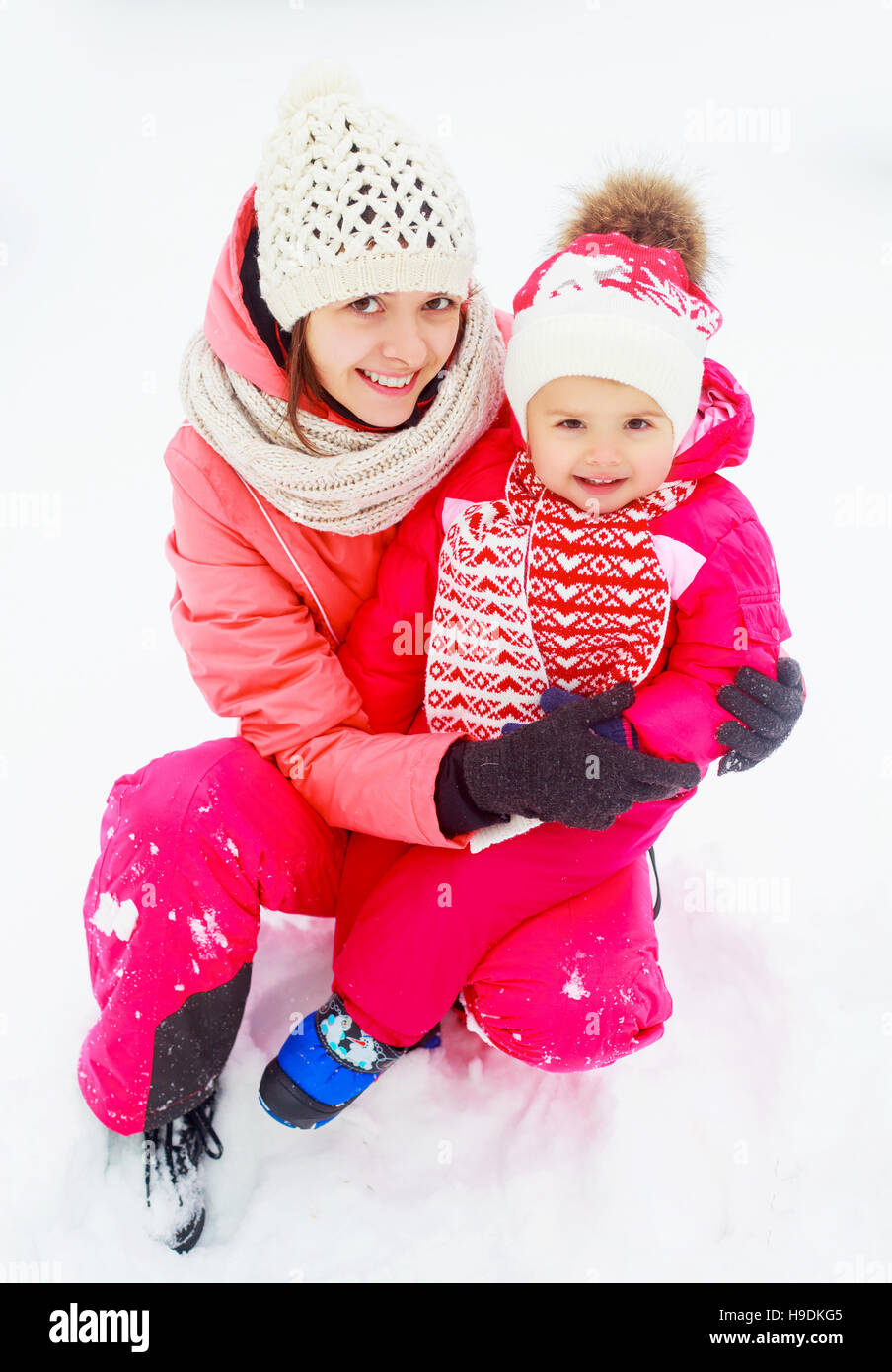 happy young mother and baby in the winter park Stock Photo Alamy