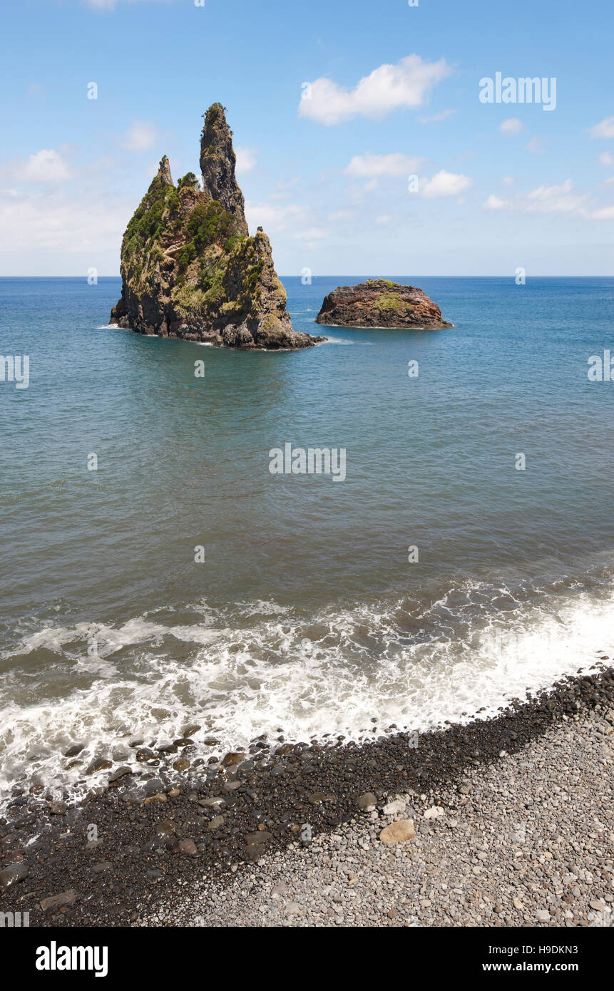 Azores coastline landscape with pebble beach in Flores island. Portugal. Vertical Stock Photo