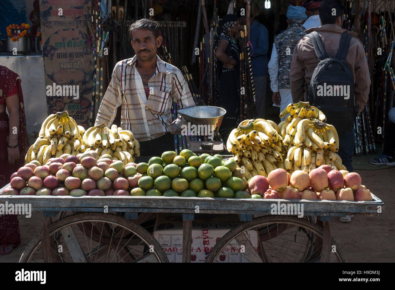 An Indian Street Vendor Selling Fruits On His Fruit Cart At Pushkar Rajasthan India Stock Photo