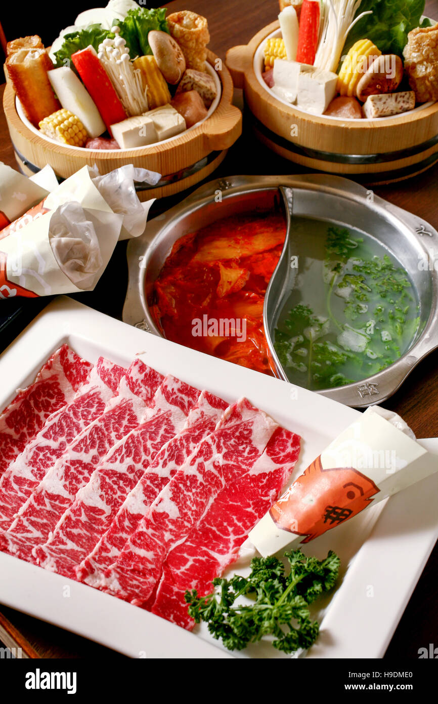 Double flavor hot pot with beef and vegetable set Stock Photo
