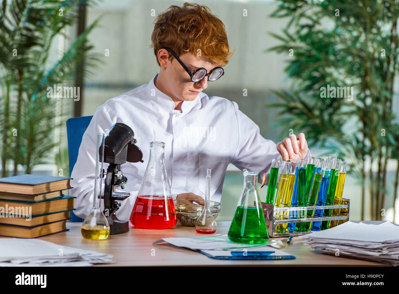 Young crazy chemist working in the lab Stock Photo - Alamy