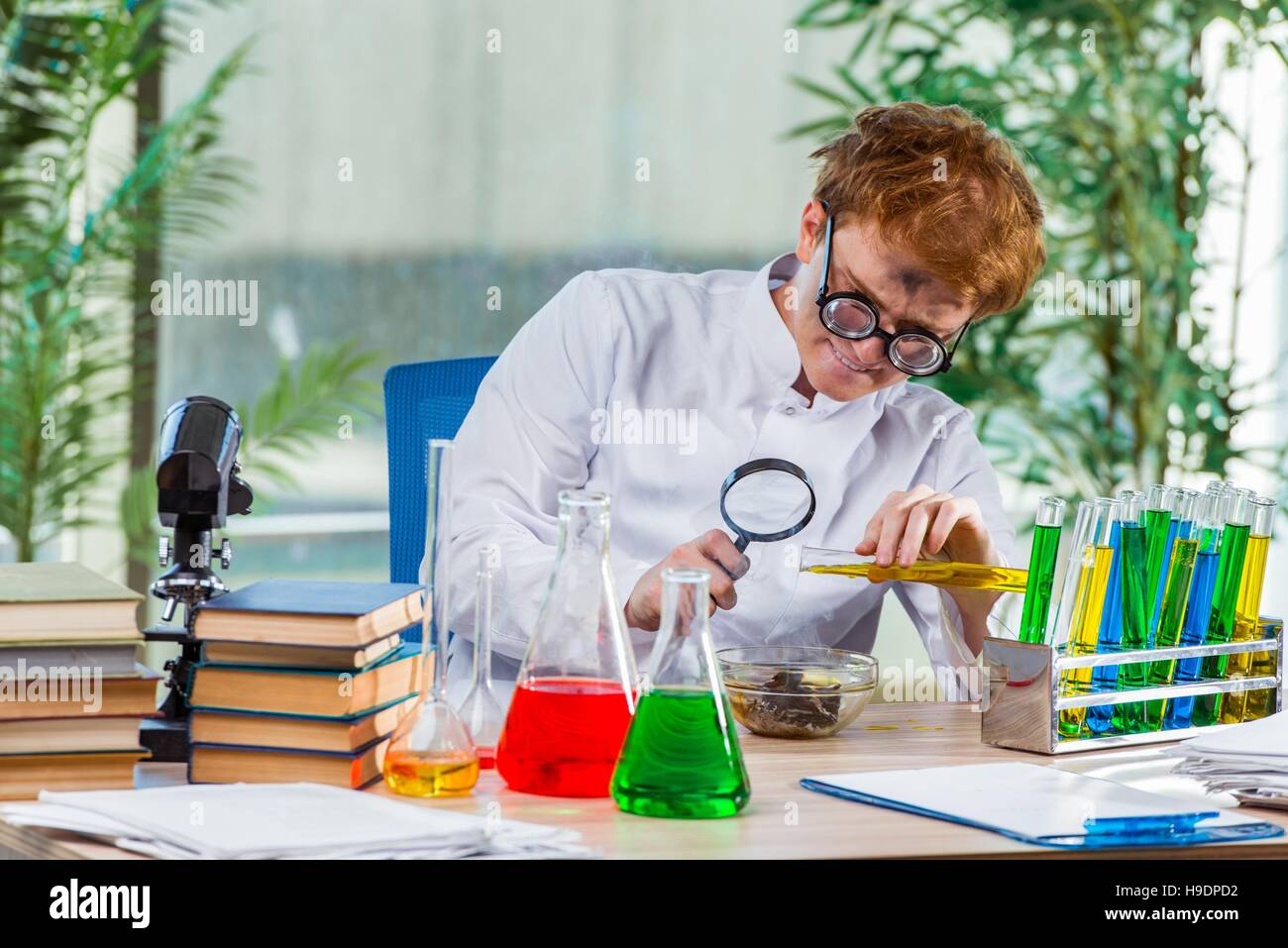 Young crazy chemist working in the lab Stock Photo - Alamy