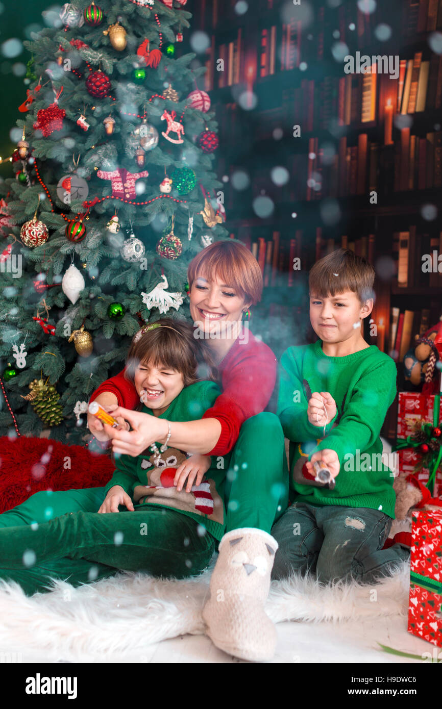Family Having Fun with Christmas Petards Stock Photo