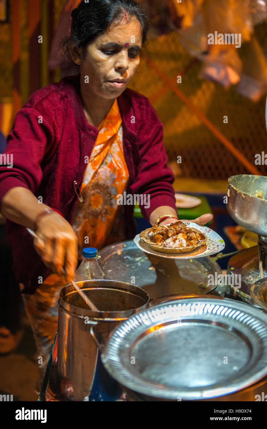 A street stall serving puchka or panipuri, semolina pastry filled with mashed potato, chickpeas, tamarind paste and chaat masala, in Calcutta. Stock Photo