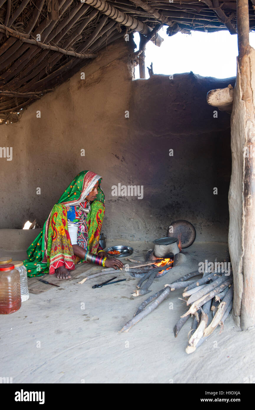 A tribal Meghawal woman prepares lunch in Hodka, a semi-arid region bordering the Great Raan of Kutch. Stock Photo