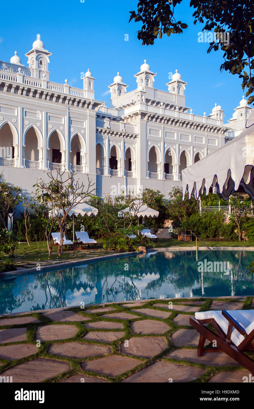 The swimming pool at Falaknuma Palace Hotel in Hyderabad, a rambling scorpion shaped mansion meaning “mirror of the sky”. India. Stock Photo