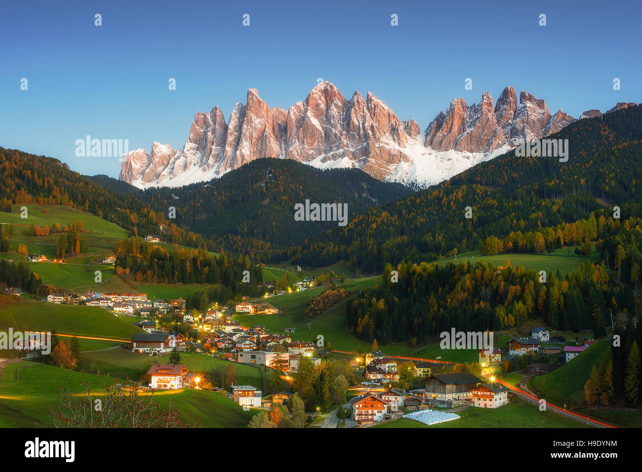 Night landscape with mountain peaks and vilage in valley Stock Photo