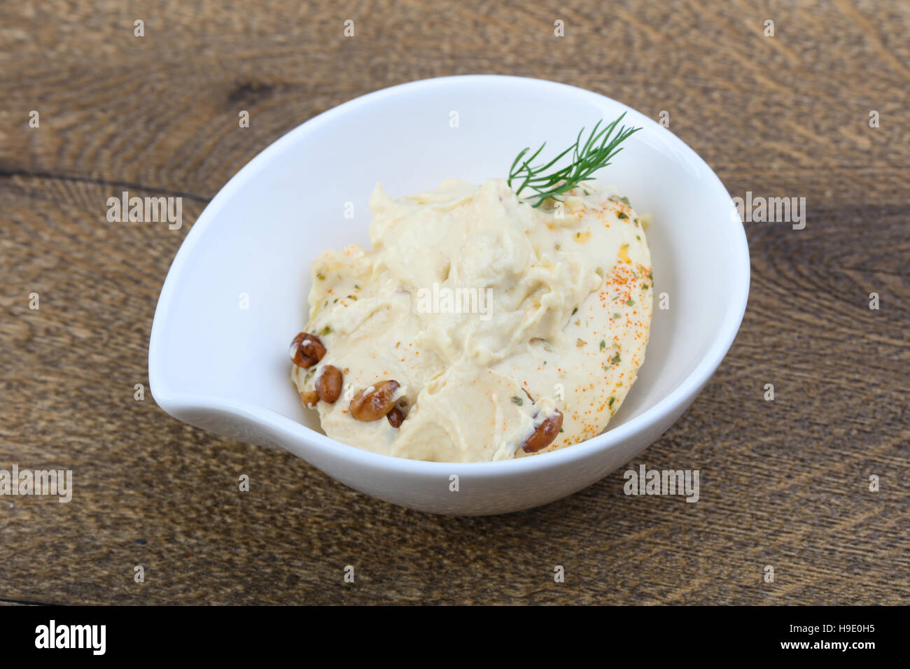 Arabic traditional cusine hummus with dill and cedar nuts Stock Photo