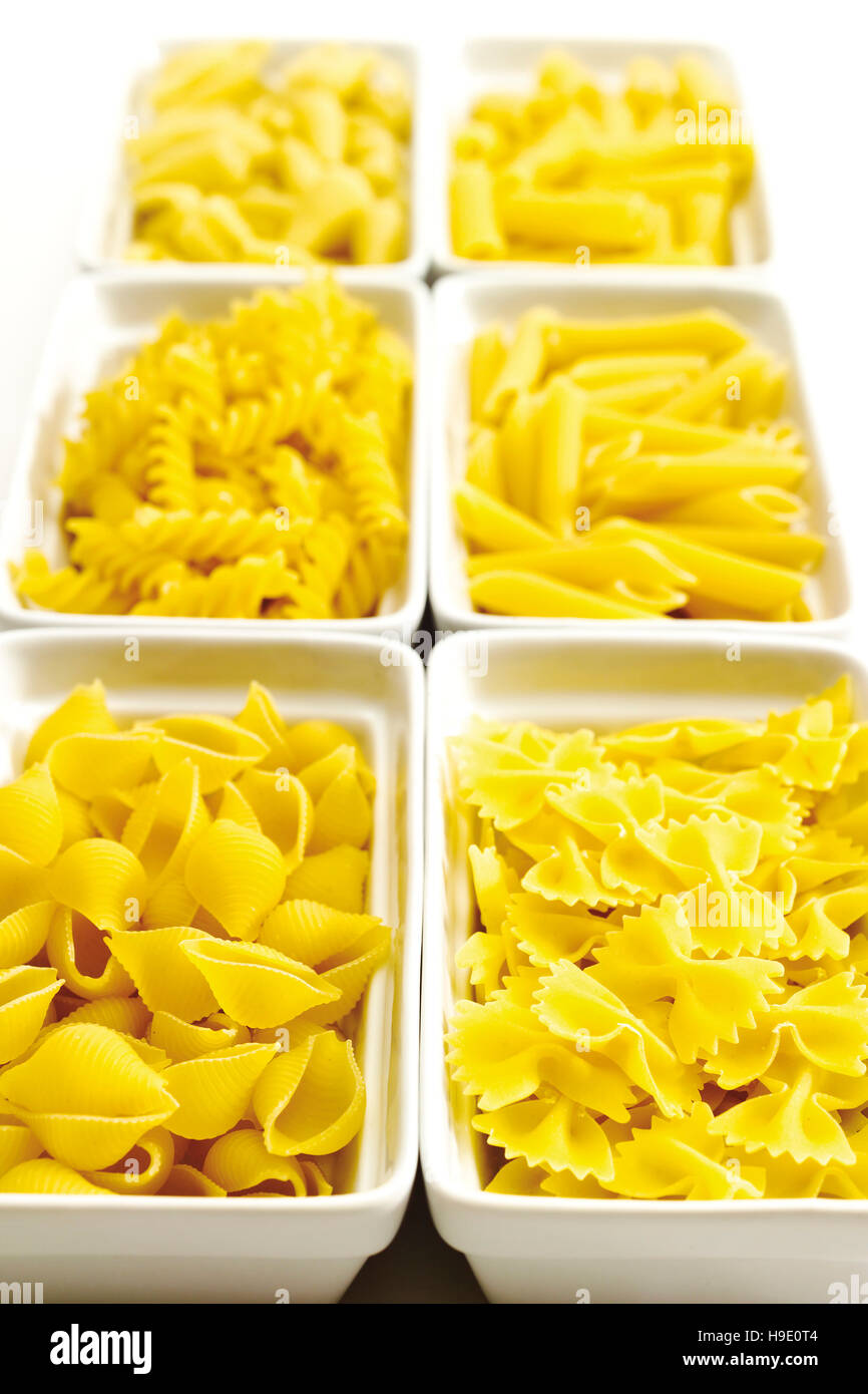 Pasta, uncooked, conchiglie, farfalle, fusilli, penne Stock Photo Alamy