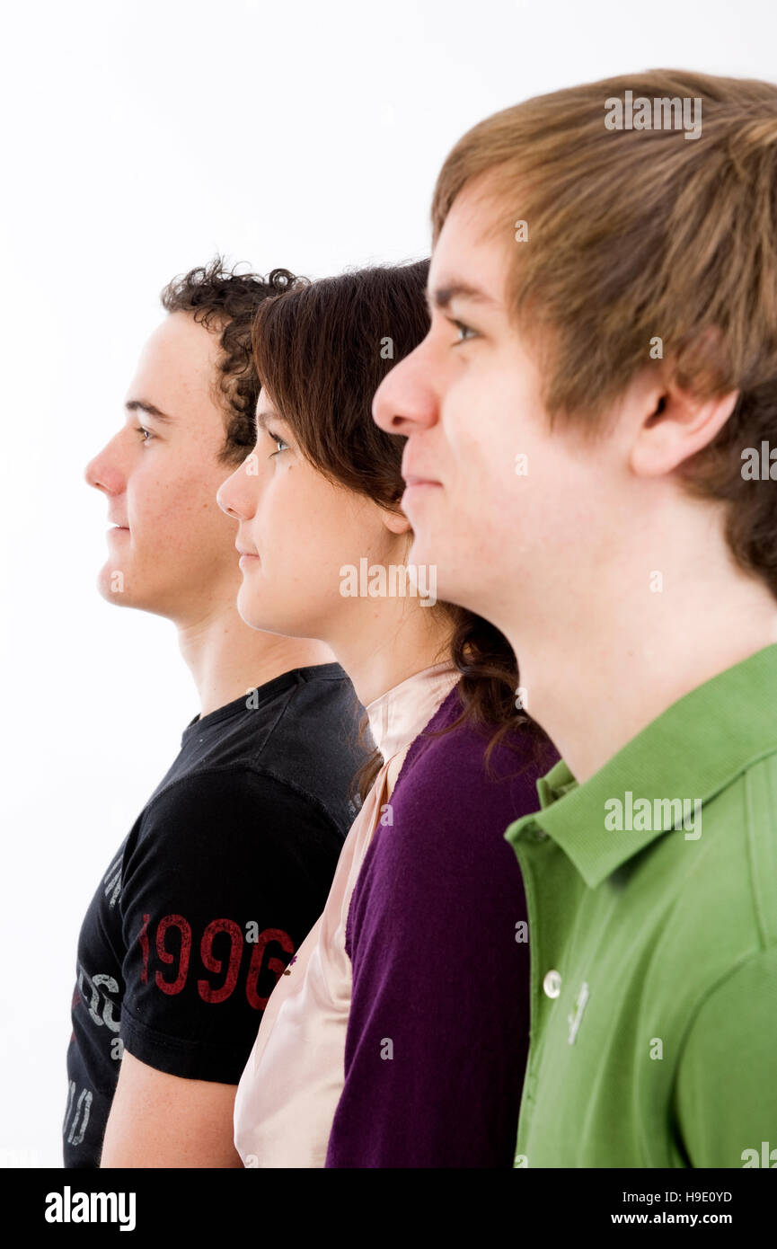 Profiles of three teenagers Stock Photo