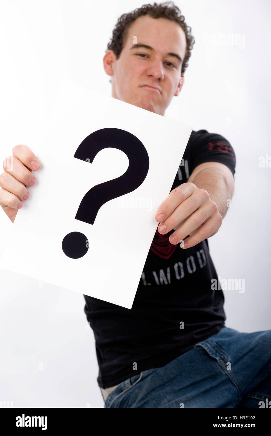 Teenager with a question mark Stock Photo