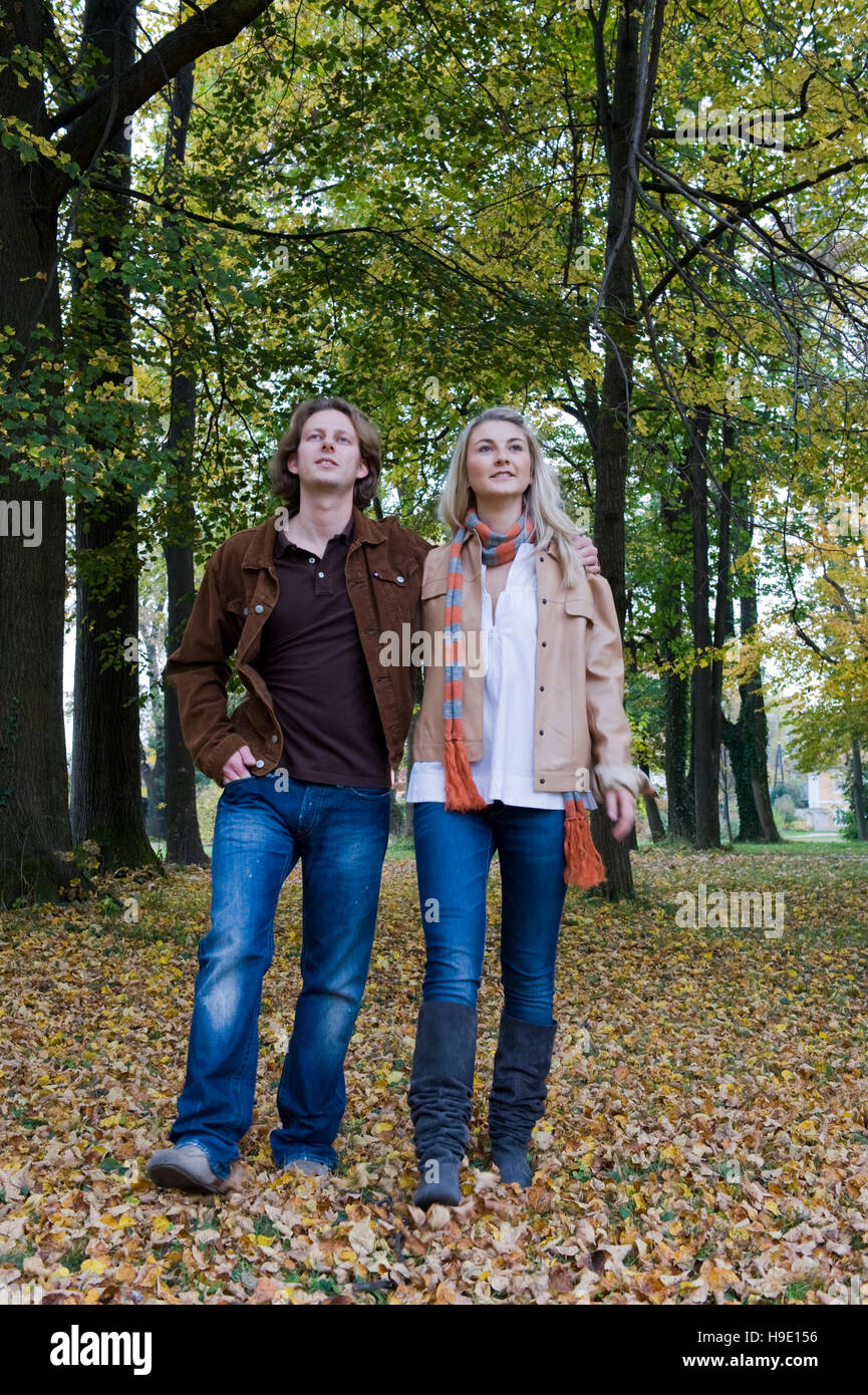 Young couple walks through park hi-res stock photography and images - Alamy