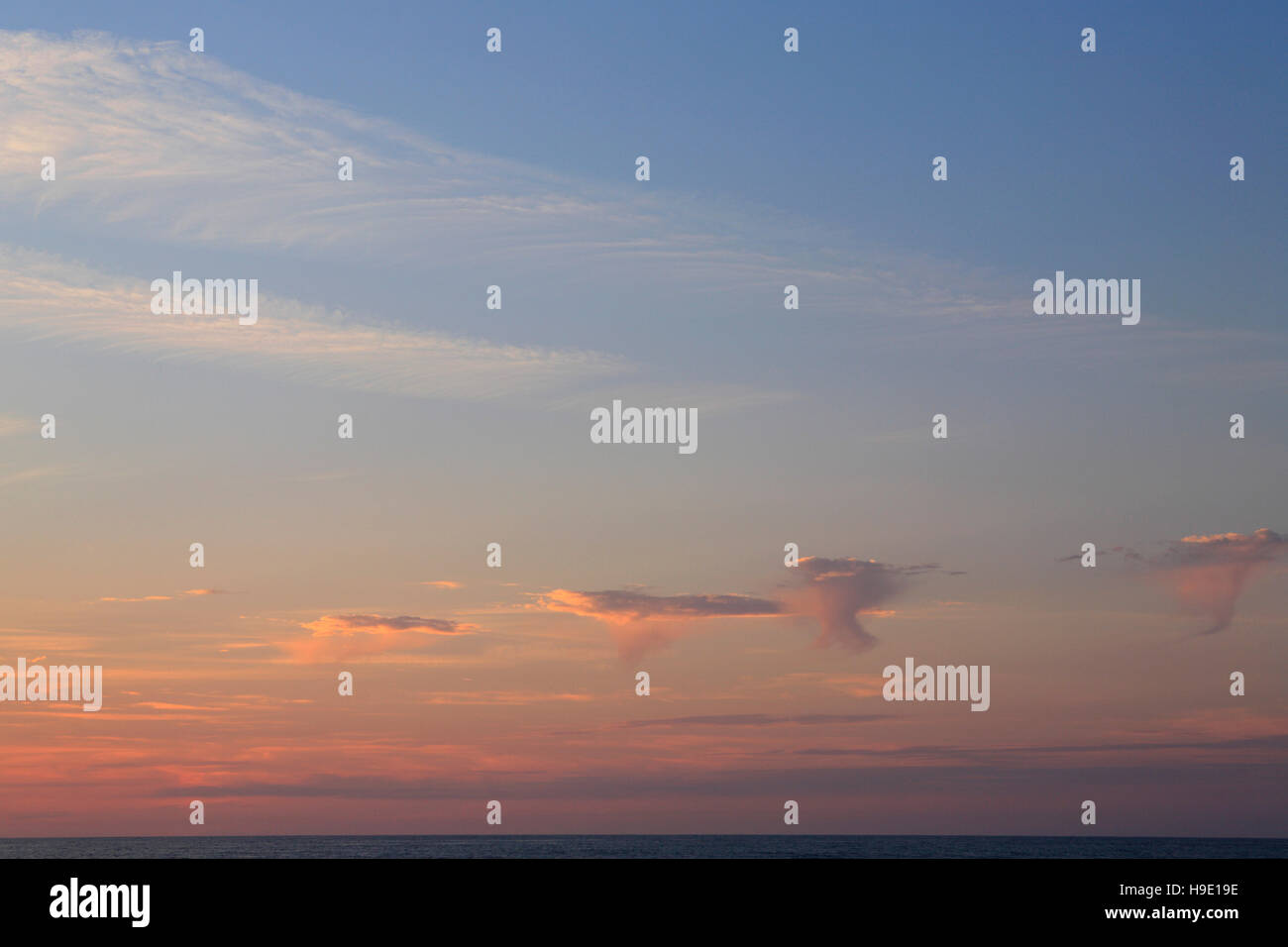 Cloudy blue sky over the sea Stock Photo - Alamy
