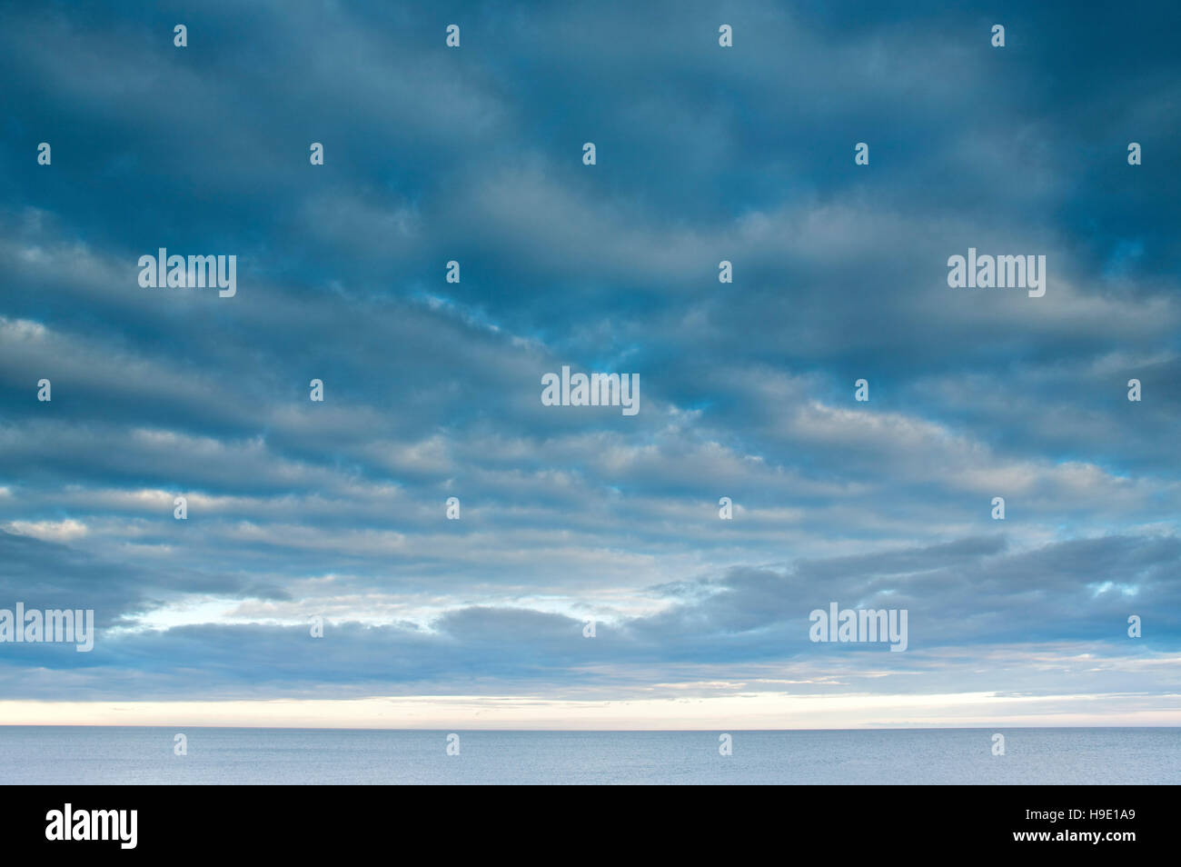 Cloudy blue sky over the sea Stock Photo - Alamy