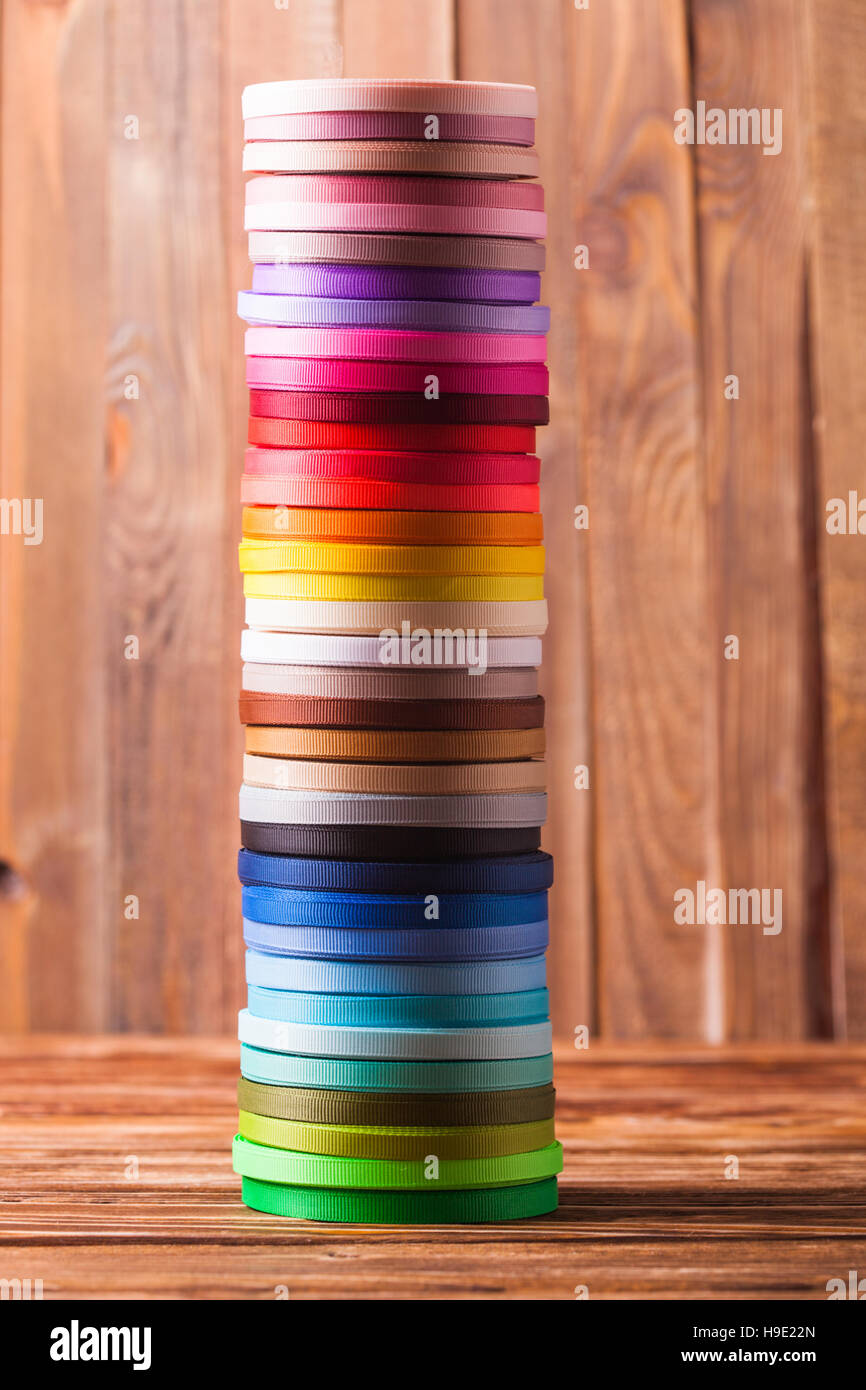 Multi Ribbon Bobbin ribbon bobbins on the table Stock Photo - Alamy