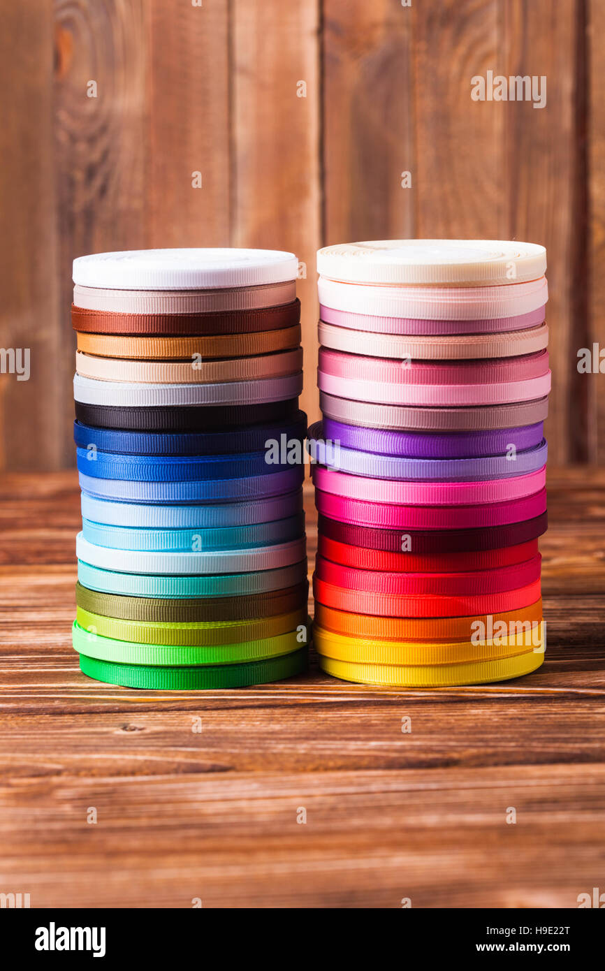 Multi Ribbon Bobbin ribbon bobbins on the table Stock Photo - Alamy