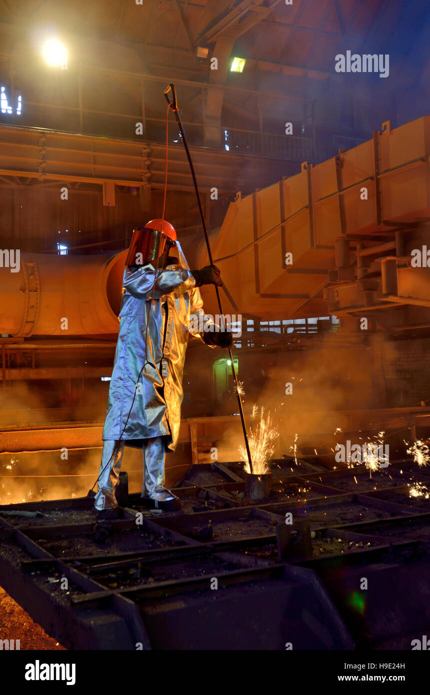Steel worker inside of steel plant Stock Photo