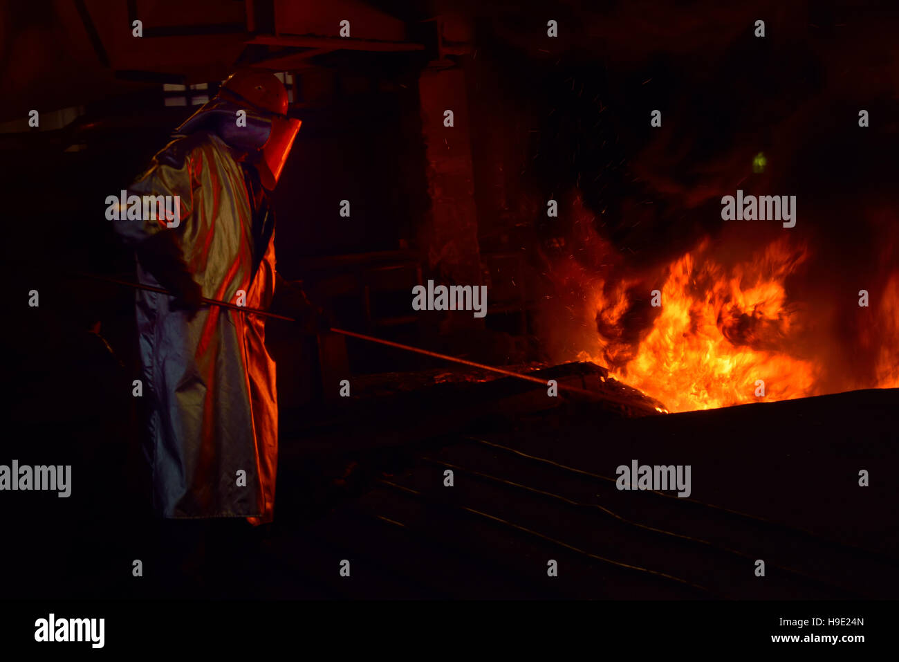 Steel worker inside of steel plant Stock Photo