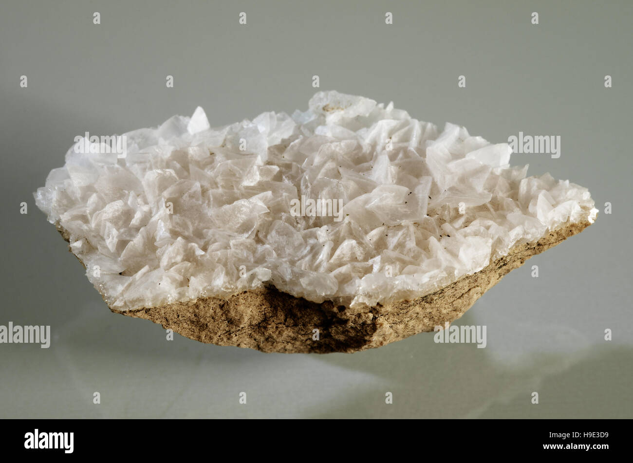 Calcite white crystal formation over a rock substrate Stock Photo