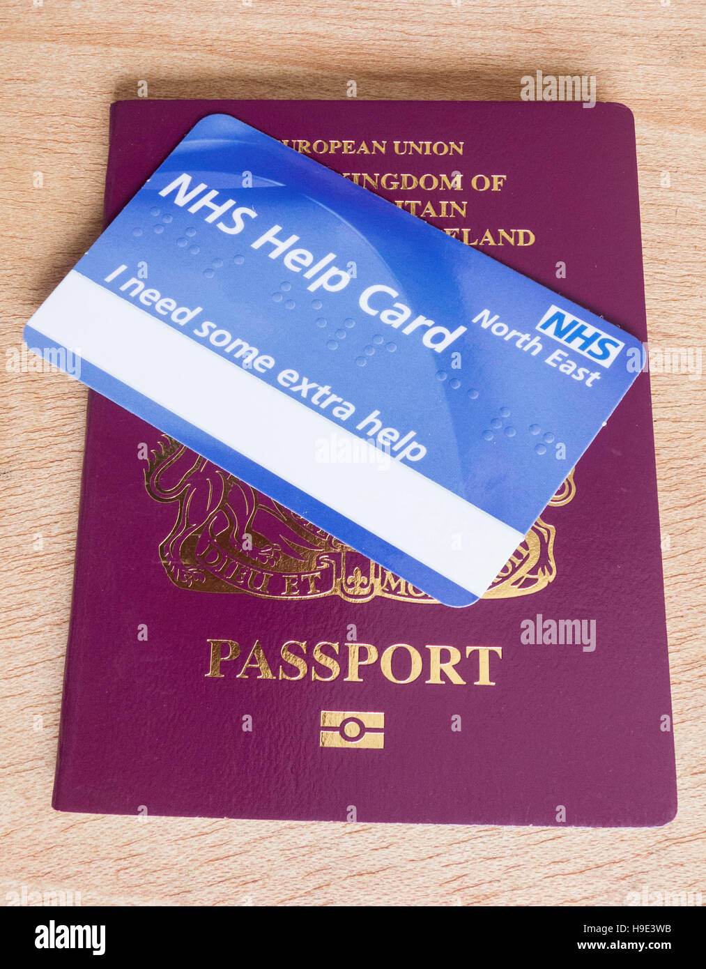 United Kingdom passport with NHS help card. England. UK Stock Photo