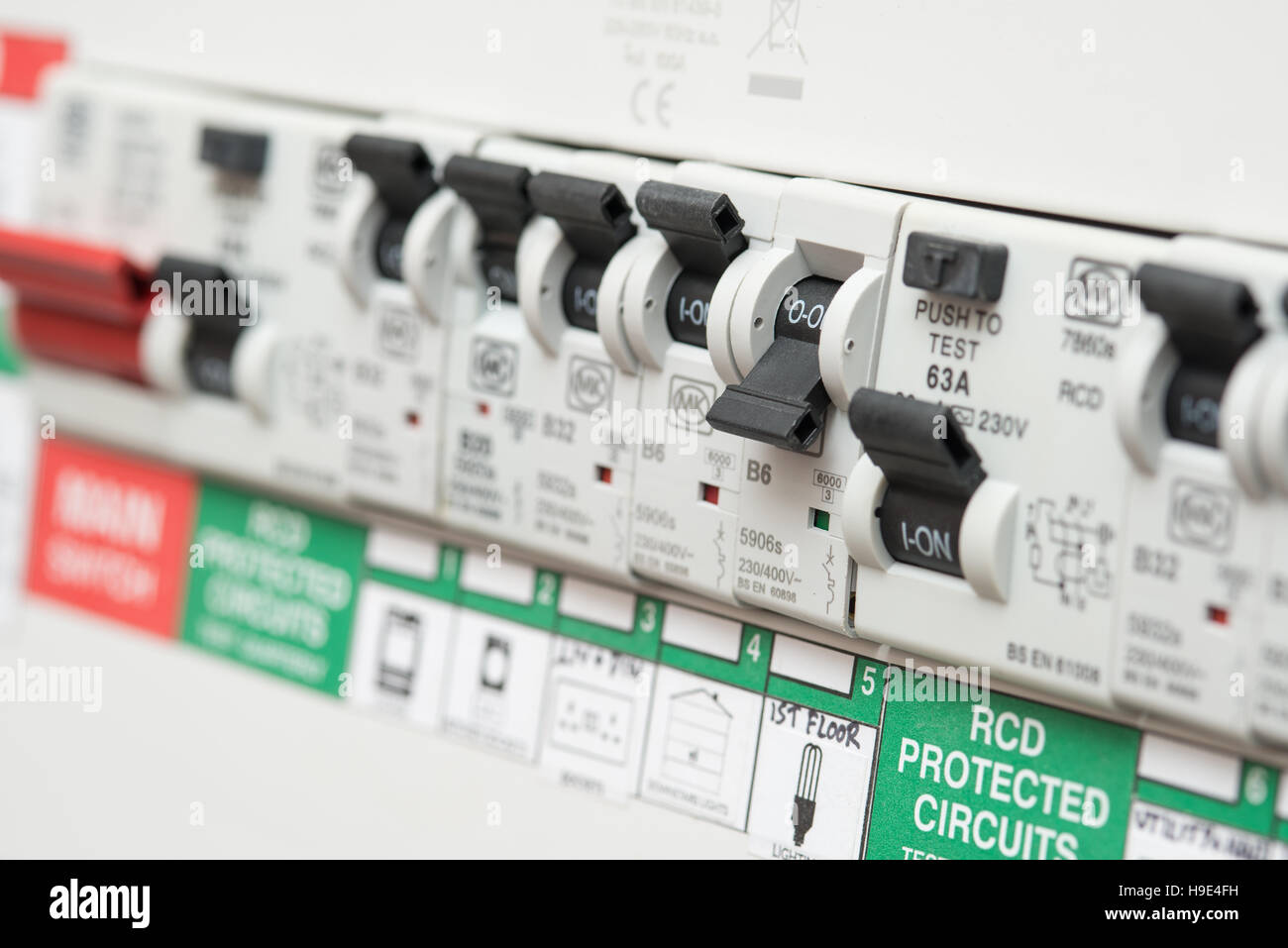 An RCD circuit breaker board displays many switches. Most are in the ON