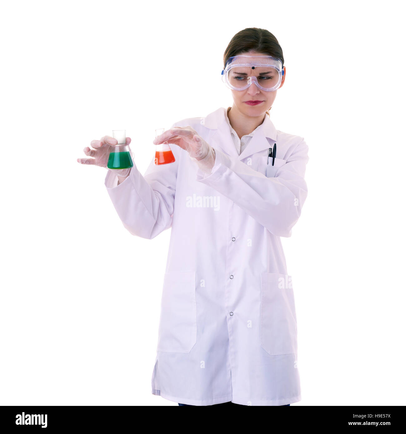 Female assistant scientist in white coat over  isolated background Stock Photo