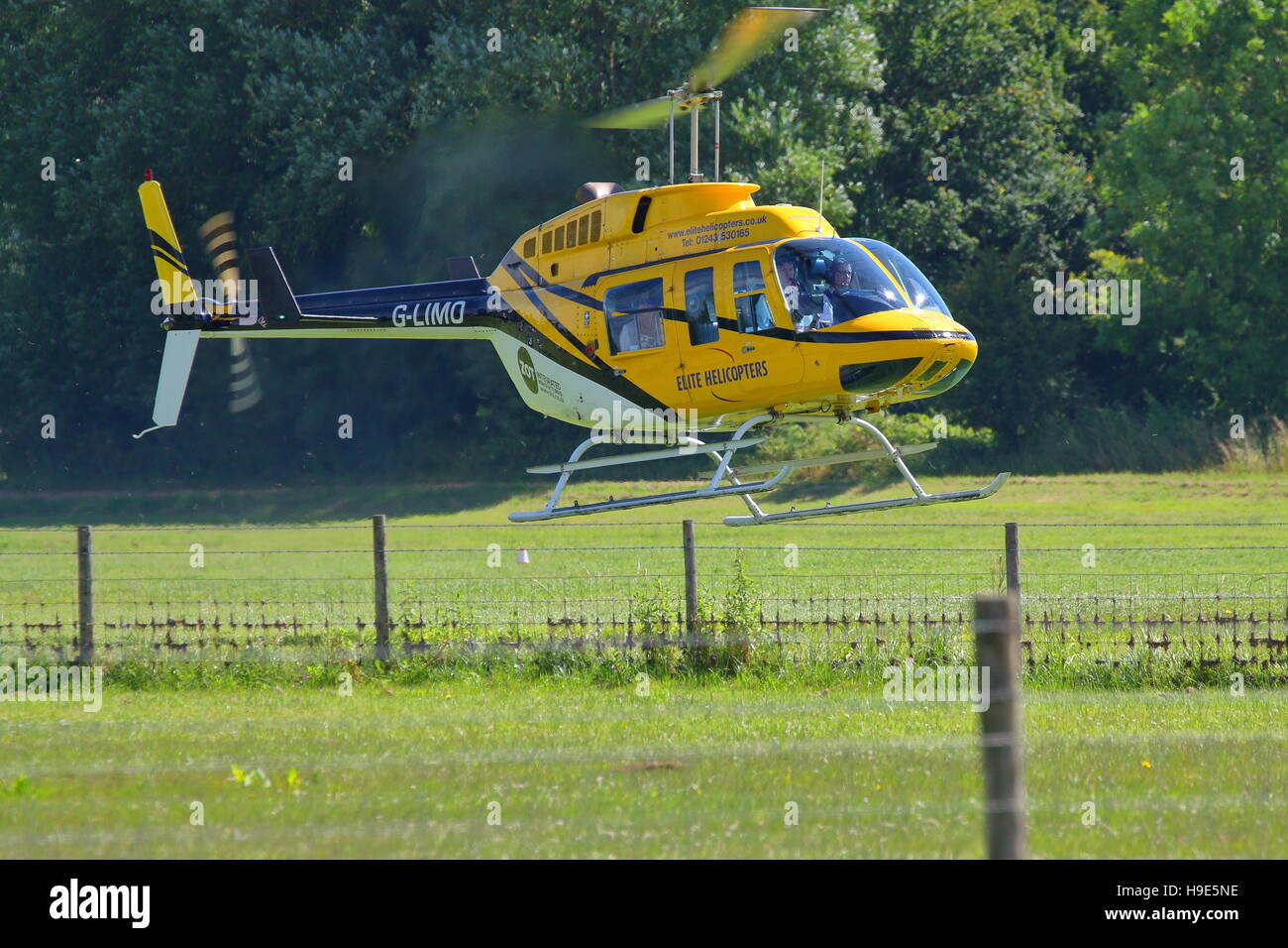 Elite Helicopters Bell 206L-1 LongRanger II G-LIMO helicopter landing in Henley-on-Thames, Mill Meadows Stock Photo