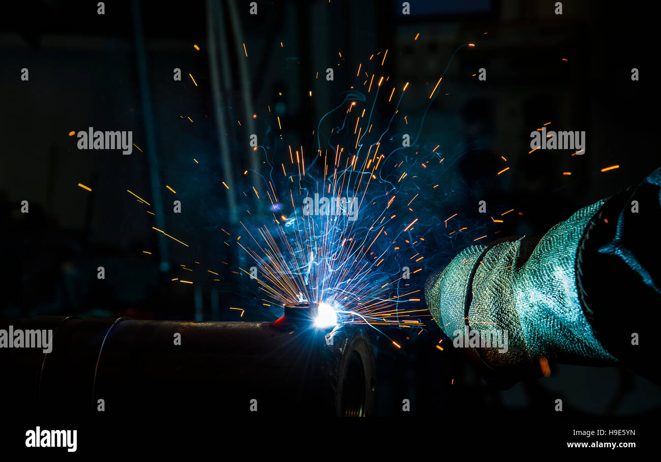 welder, craftsman, erecting technical steel Industrial steel welder in ...