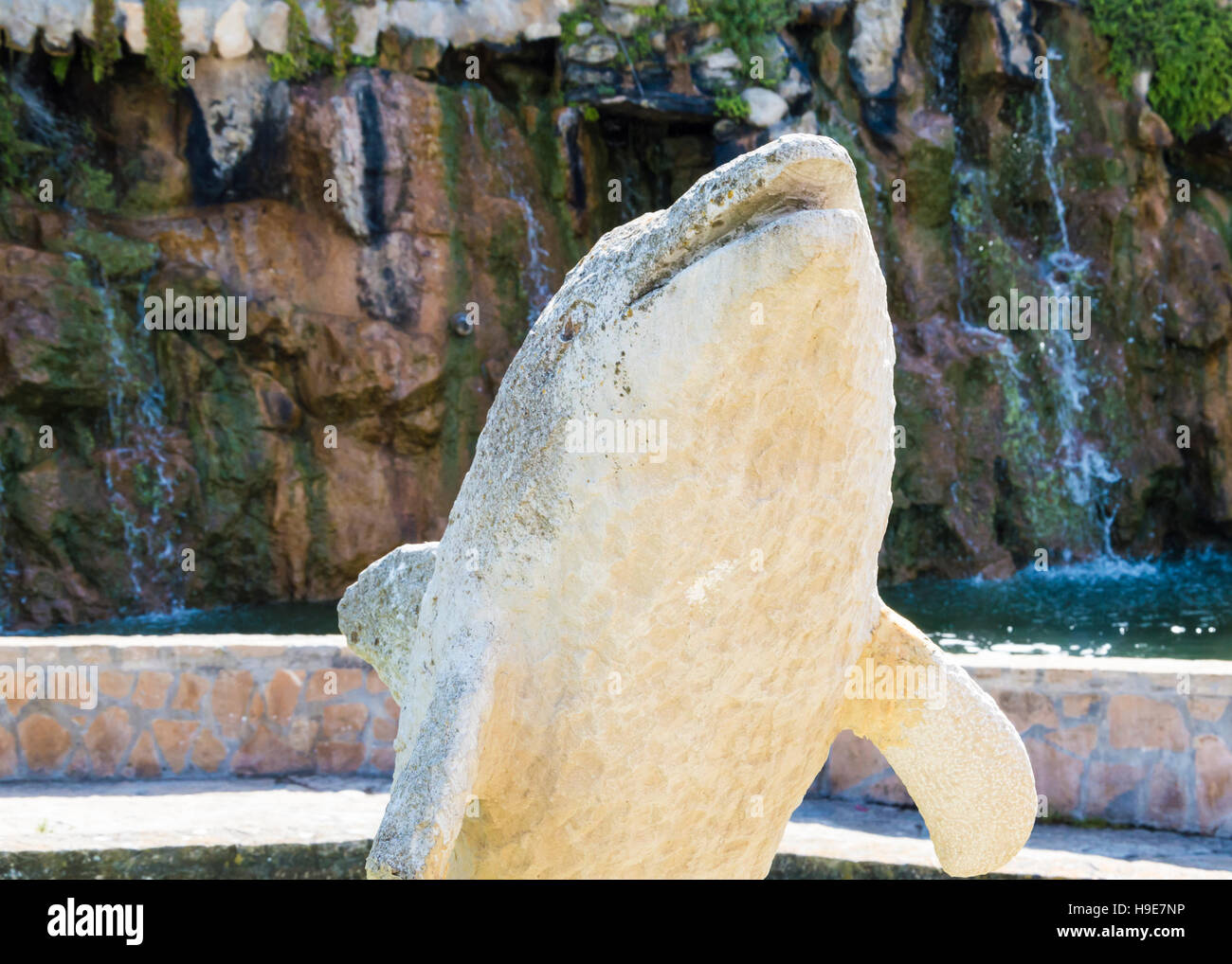 Fountain with stone dolphin sculpture in Portugal Stock Photo Alamy