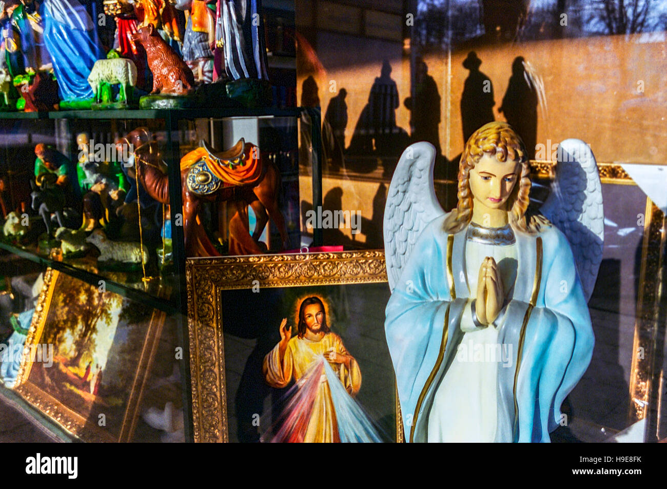 Czestochowa Poland, Shop Window Display with Religious Votive Products Articles Sacred Roman Catholic Saints Angel, Business Stock Photo