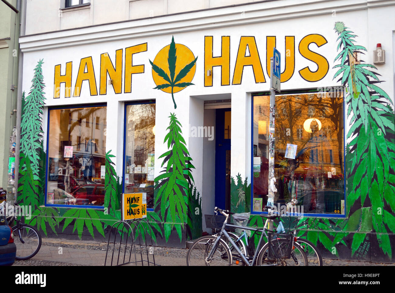 Front of a shop in Berlin Kreuzberg district selling hemp products, vibrant and colourful graffiti/ wall art, Berlin, Germany Stock Photo
