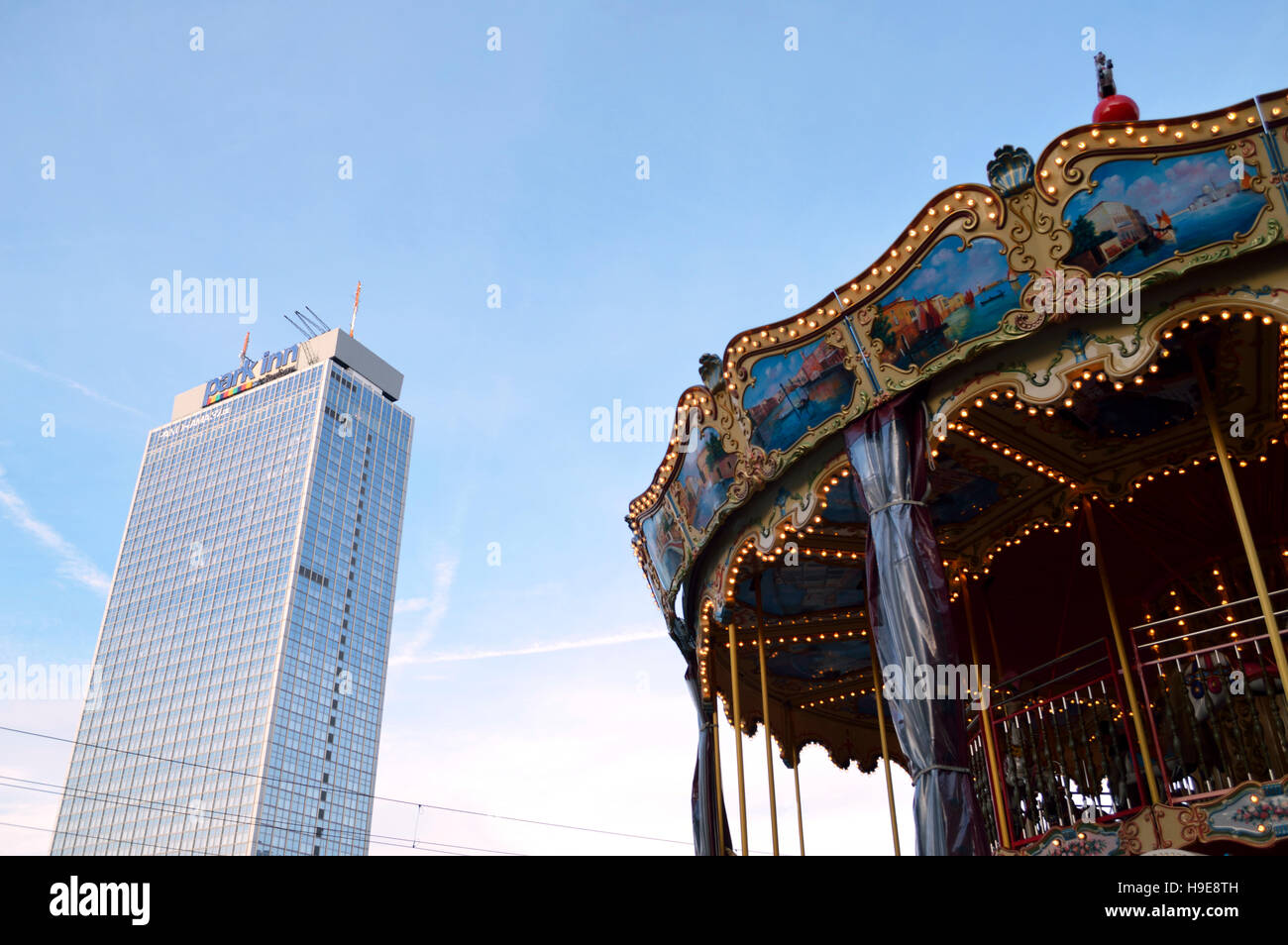The Park Inn Hotel at Berlin Alexanderplatz with a carousel in the foreground, Germany Stock Photo