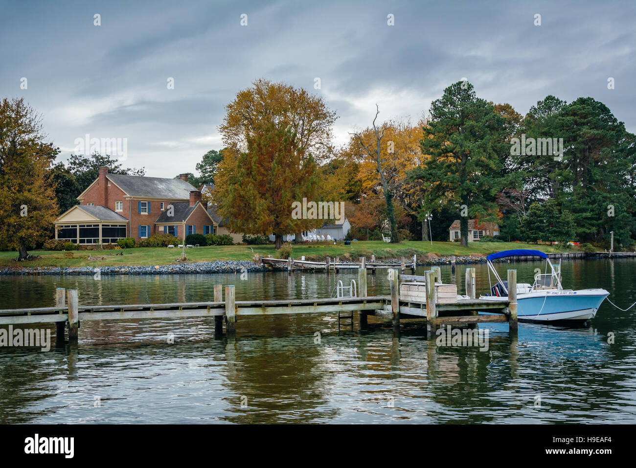 House and autumn color along the harbor in St. Michaels, Maryland. Stock Photo