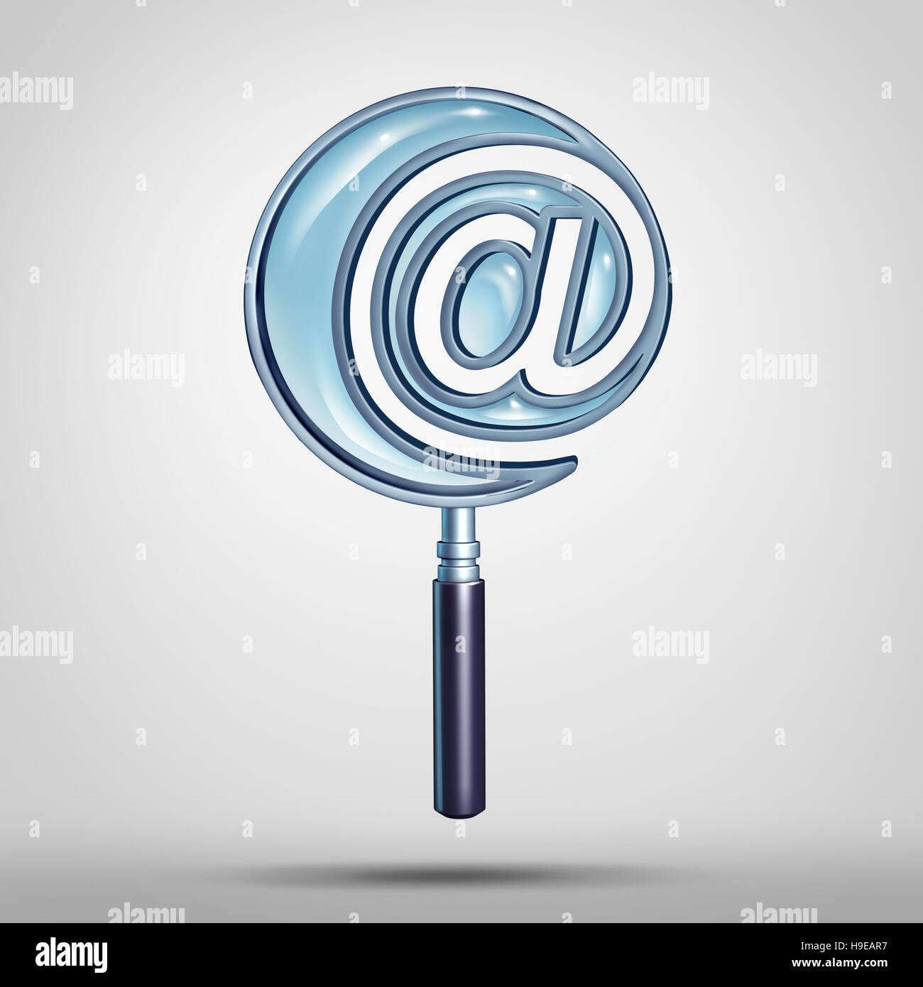 Email and internet search technology concept as a magnifying glass shaped as an e-mail symbol or at sign icon as a cyber and website address  metaphor Stock Photo