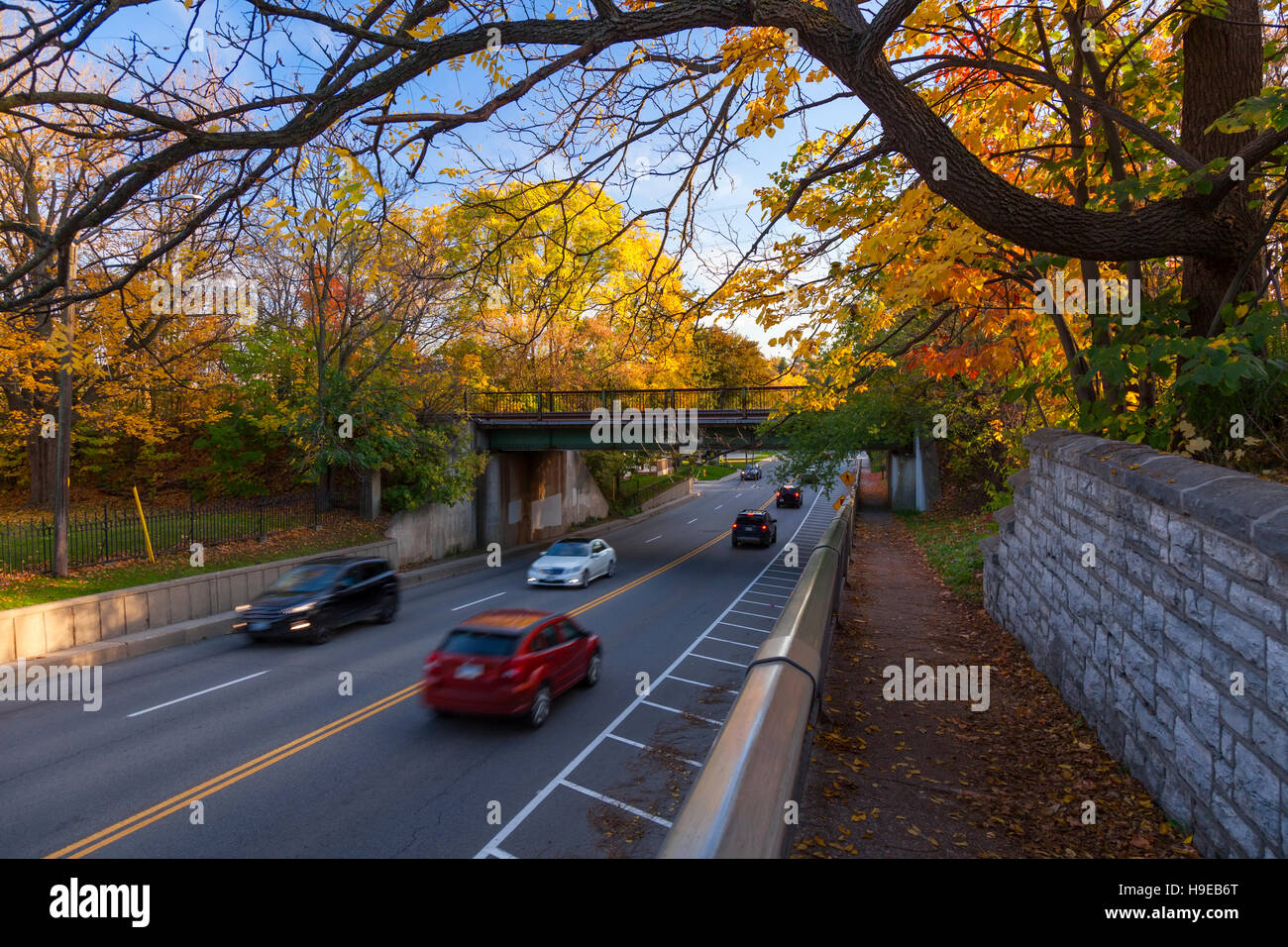 A train bridge over Grand River Street with autumn colours in Paris
