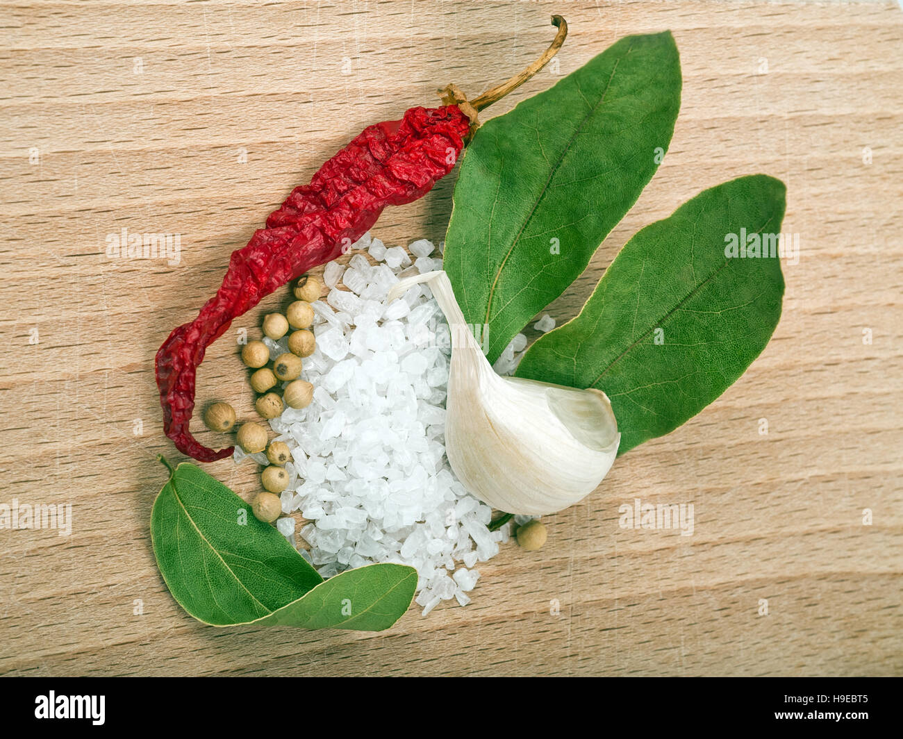 Cooking salt, pepper grains ,garlic,bay leaves and chili peppers Stock