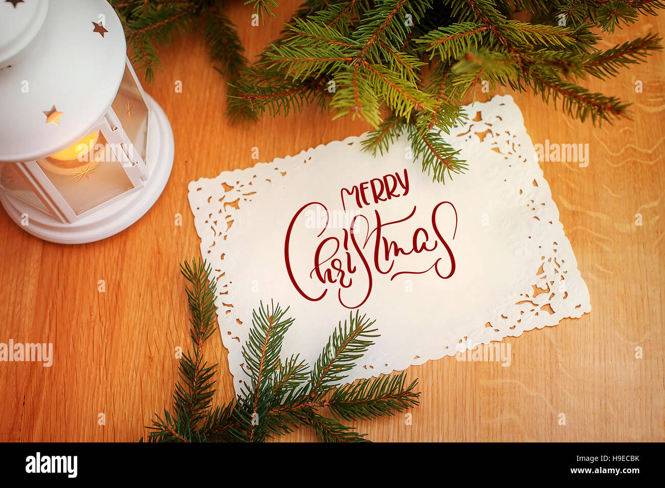 Holiday Card, invitation with Candle and Fir Tree. text Merry Christmas. Calligraphy lettering Stock Photo