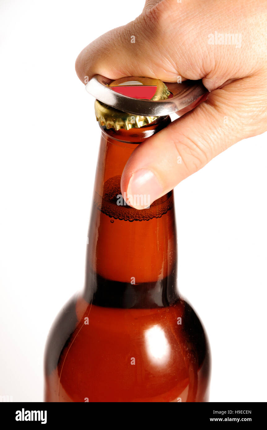 hand opening a beer bottle Stock Photo