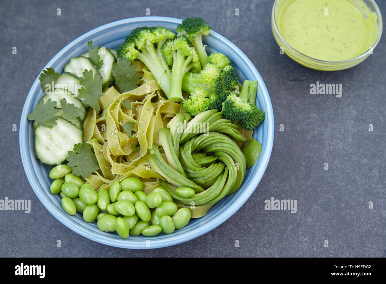 Vegetarian pasta with cucumber, broccoli, avocado and edamame Stock