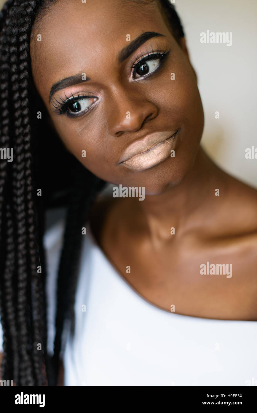 portrait photo of african girl in white dress. evening make up, white lips,  big eyes Stock Photo - Alamy