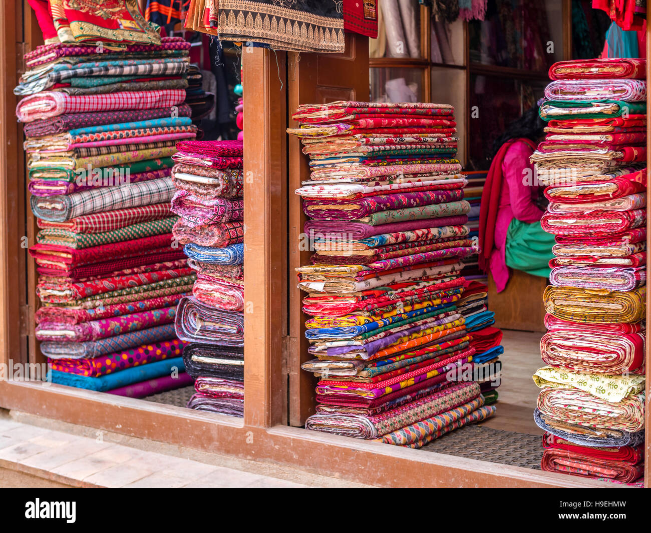 Colorful bolts of fabric at street shop in Nepal Stock Photo