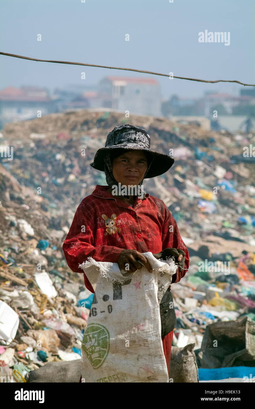 A scavenger at the former Stung Meanchey garbage dump (nicknamed Smokey Mountain) in Phnom Penh (the land fill closed July 2009) Stock Photo